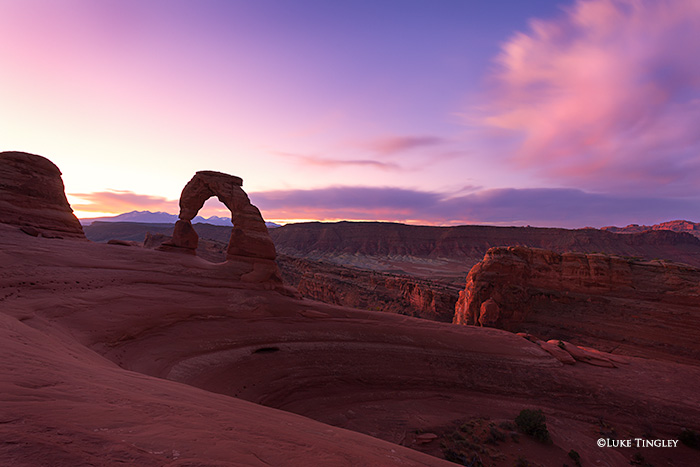 Sunrise at Delicate Arch in Arches National Park.