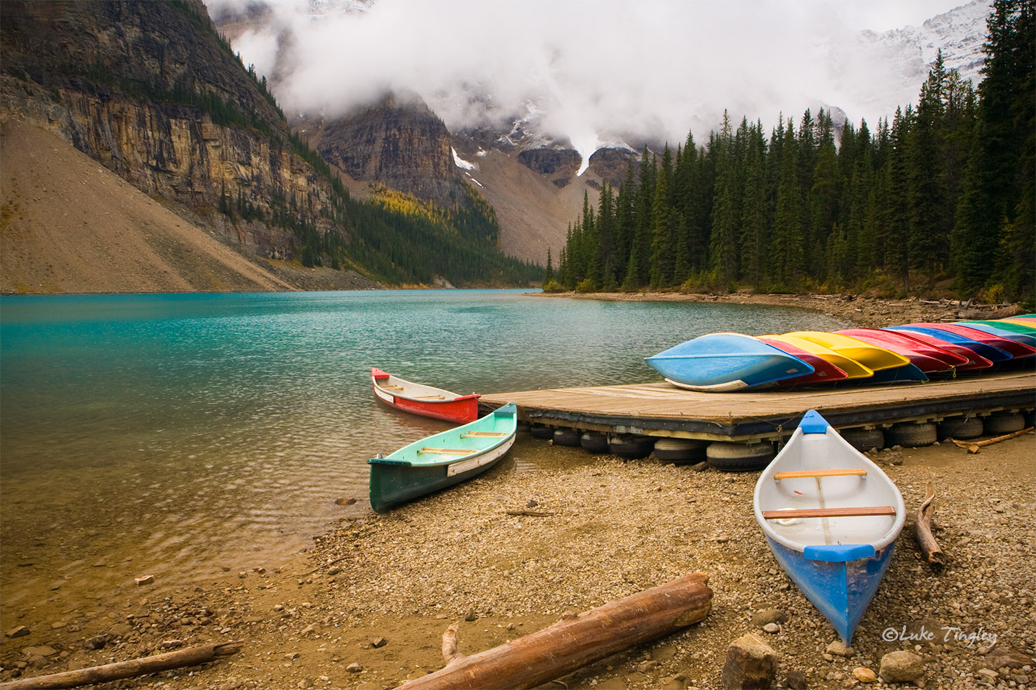 Moraine Lake, Banff National Park, Canada, clouds, fog, canoes, blue water, fall, red canoe, blue canoe, green canoe, Canadian...