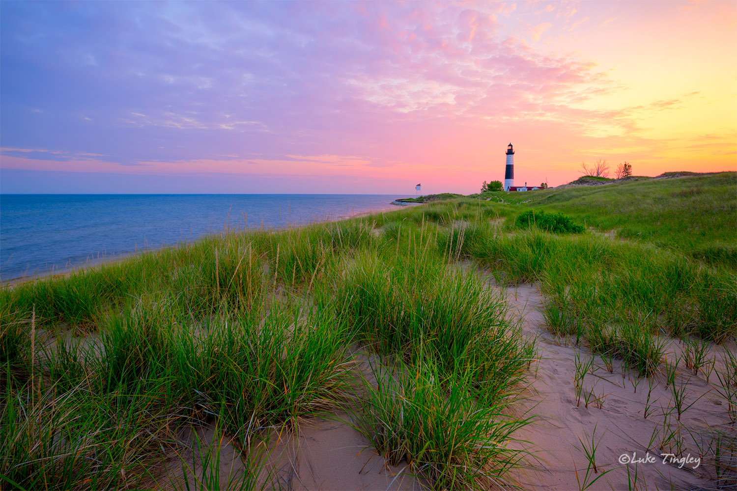 Big Sable Point - Moments after the lighthouse light winked out, sunrise breaks on a beautiful morning after a storm on the shores...